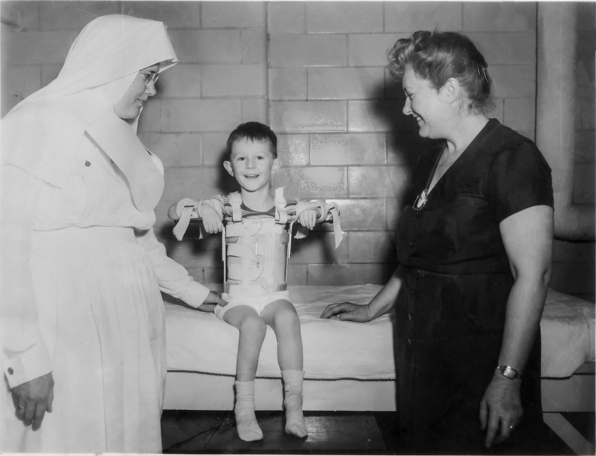 Back Of Photo Says June 29. 1951 Sister Alacoque Geppert Patient Timmy And Ruth Whittenmore Scaled
